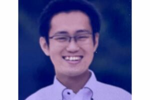 丸刈り姿で写る福原優理容疑者（前任校の卒業アルバムより）