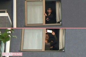 昨年11月、マンションから顔をのぞかせる橋本と付き合っていたという女性