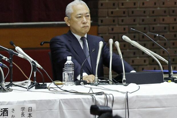 会見に参加する澤田康広副理事長　写真/共同通信社
