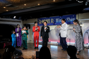 2023年年末に行われた『金嶋昭夫Winter Show』には夢グループの石田重廣社長がゲストとして駆けつけた