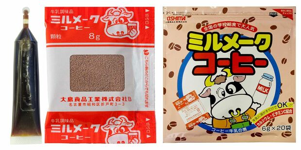 【左】学校給食用の『ミルメークコーヒー（液体）』。さらにココア、いちごもある。【中】学校給食用の『ミルメークコーヒー（顆粒）』。「今も、もちろん現役です」。【右】牛のキャラがほのぼのかわいい家庭用。中には給食用と同じ個包装が入っている